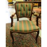 A modern Continental style, stained beech framed open arm chair, part button upholstered in