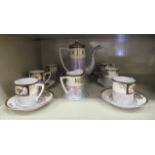 A Noritake porcelain coffee set  comprising six place settings, a coffee pot and cream jug