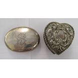 A late Victorian silver heart shaped dressing table box and cover, embossed with flora, scrolls