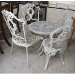 A modern white painted aluminium patio table  22"h  27"dia; and four matching chairs