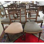 A set of eleven Edwardian mahogany framed dining chairs, each with a bobbin turned crest, raised