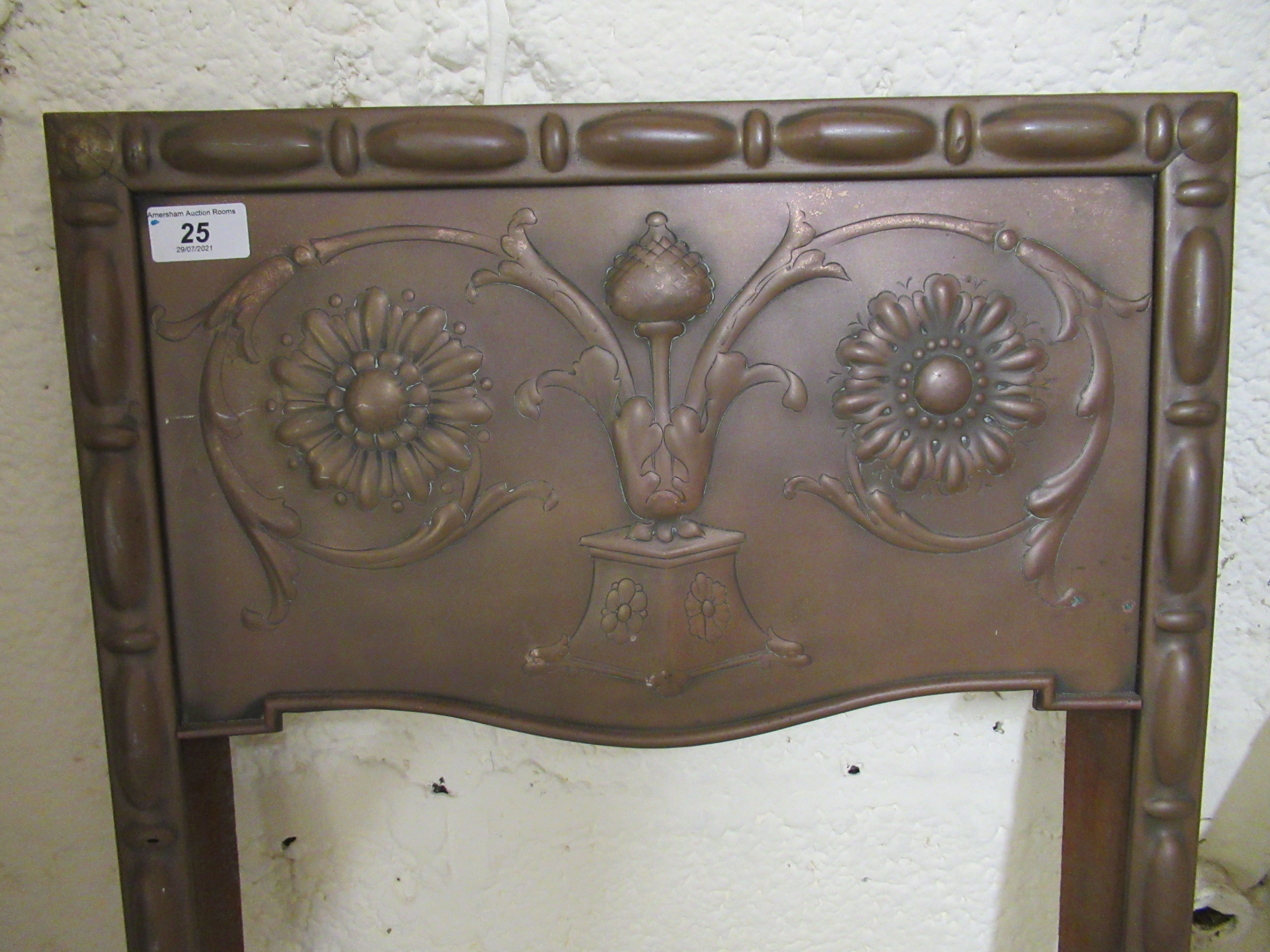 An Art Nouveau floral embossed copper front and cast iron fire grate with a five bar serpentine - Image 2 of 2