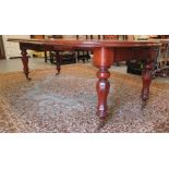 A late Victorian mahogany wind-out dining table, raised on octagonal, fluted legs and casters  29"h