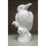 A modern Meissen ivory glazed porcelain model bird, perched on a log  impressed 77335  4"h