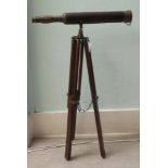 A modern reproduction of a 19thC brass telescope, on a tripod stand  26"h