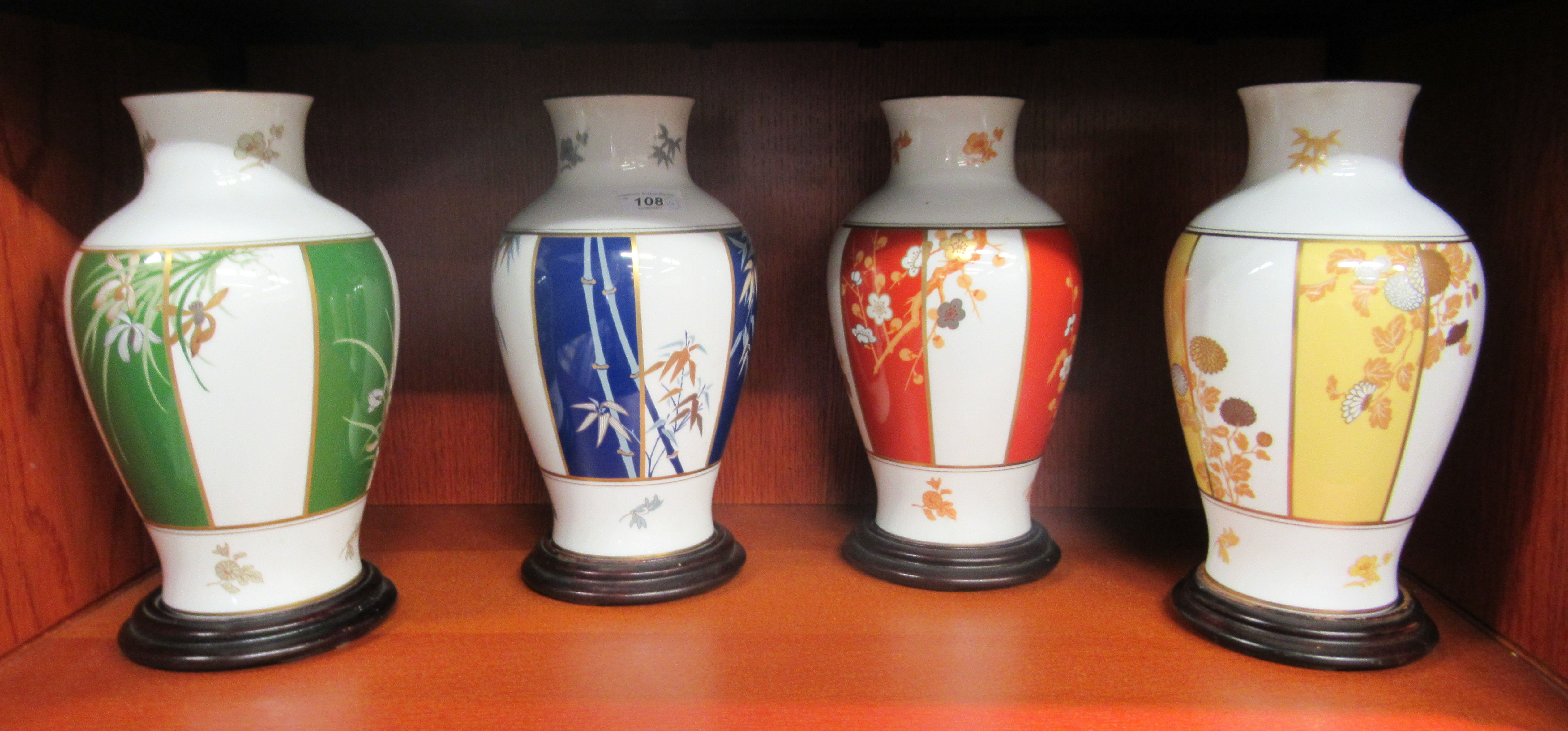 A set of four modern Franklin Mint porcelain vases, decorated in Japanese taste  11"h