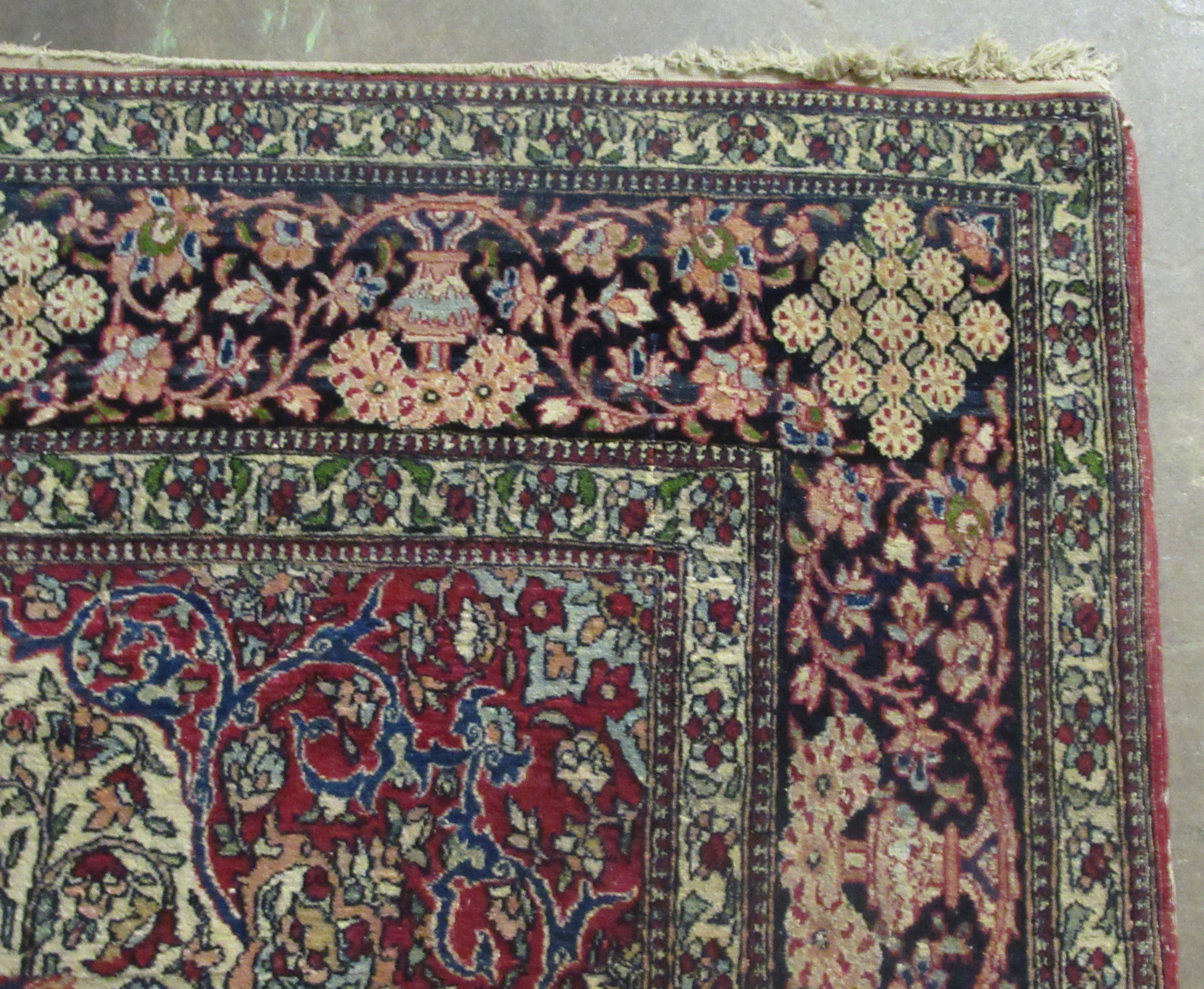 A Persian rug, decorated with a serpentine outlined medallion, bordered by stylised designs on a - Image 3 of 5