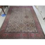 A Kerman carpet, decorated stylised floral designs, on a multi-coloured ground  100" x 118"