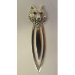 A silver and ruby set, novelty wolf's head page marker
