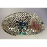 A white metal and enamel novelty fish design vesta case with a hinged cap  stamped 800