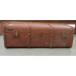 A vintage Travelux canvas and beech bound trunk with wooden bracket supports  12"h  36"w