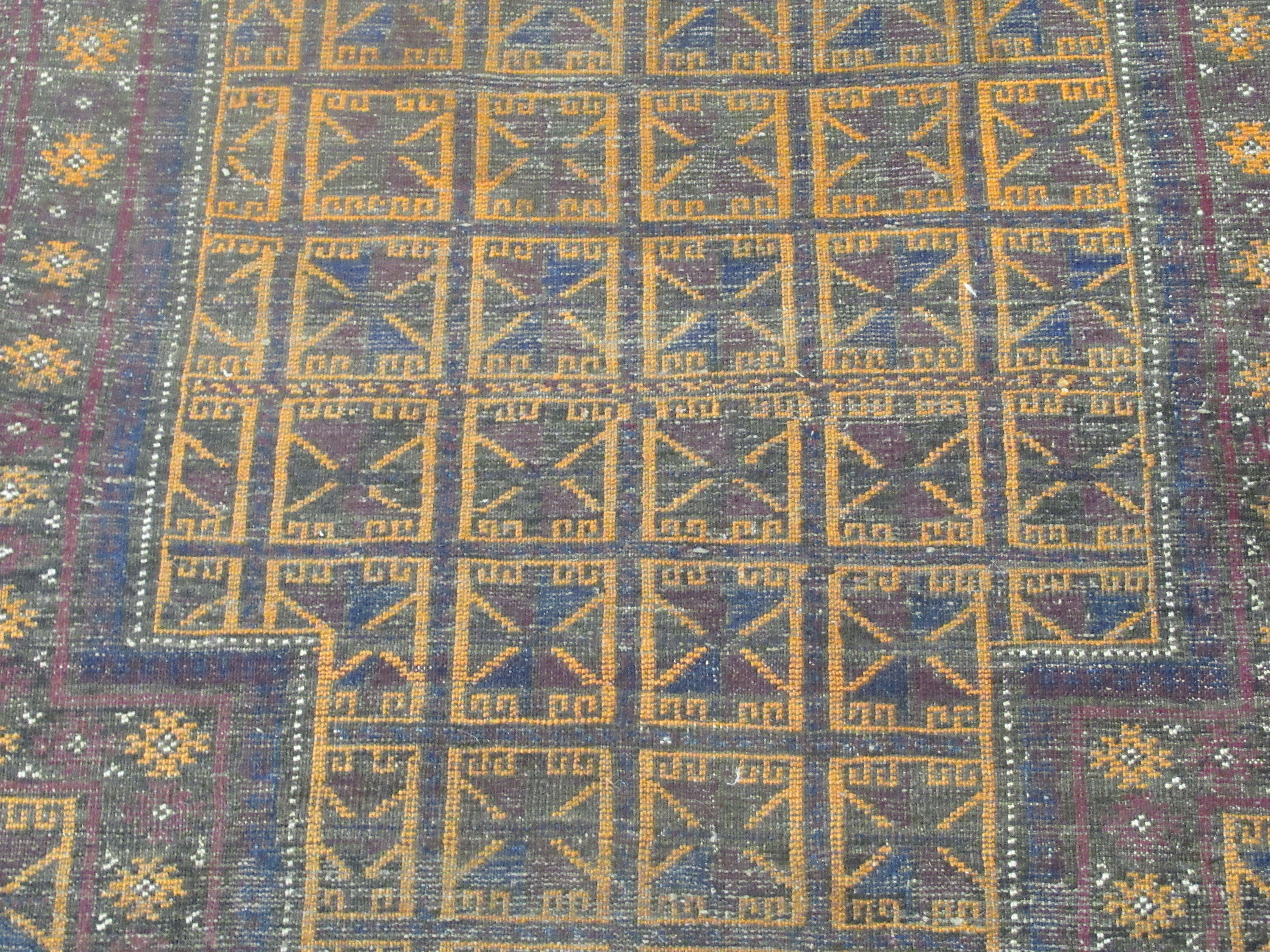 A Baluchistan rug, decorated with repeating stylised designs, on a brown ground  35'' x 42'' - Image 2 of 6