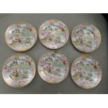 A set of six mid 20thC Japanese porcelain plates, traditionally decorated with gilding and figures