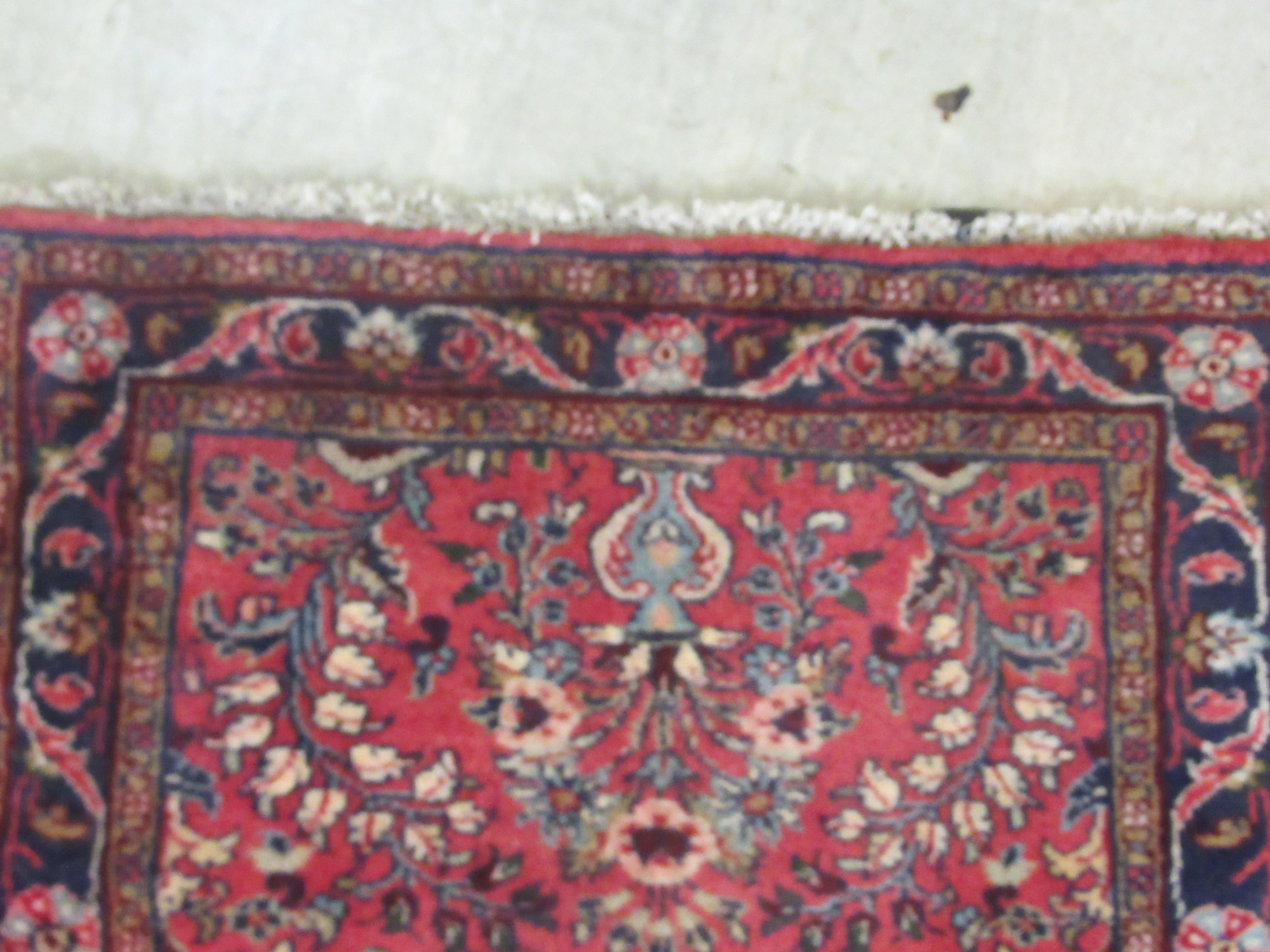 A Persian runner, decorated with floral motifs, on a red ground  106'' x 33'' - Image 3 of 5