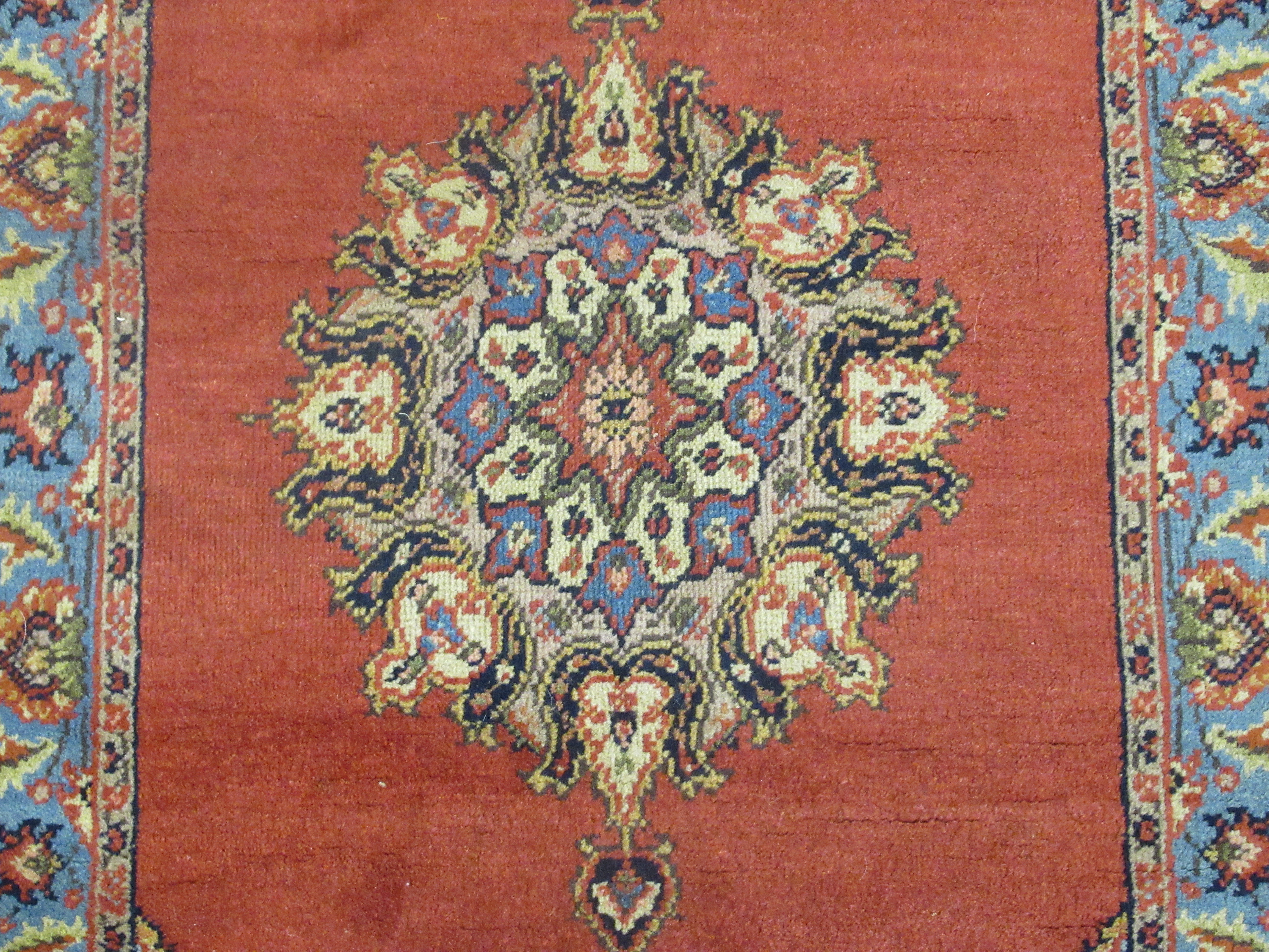 A Tabriz rug, decorated with a central medallion, bordered by floral designs, on a red ground - Image 2 of 5