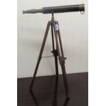 A modern reproduction of a 19thC brass telescope, on a tripod stand  26''h