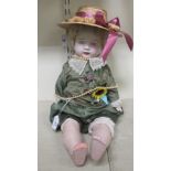 An early 20thC papier-mache doll with a fabric body  22"h