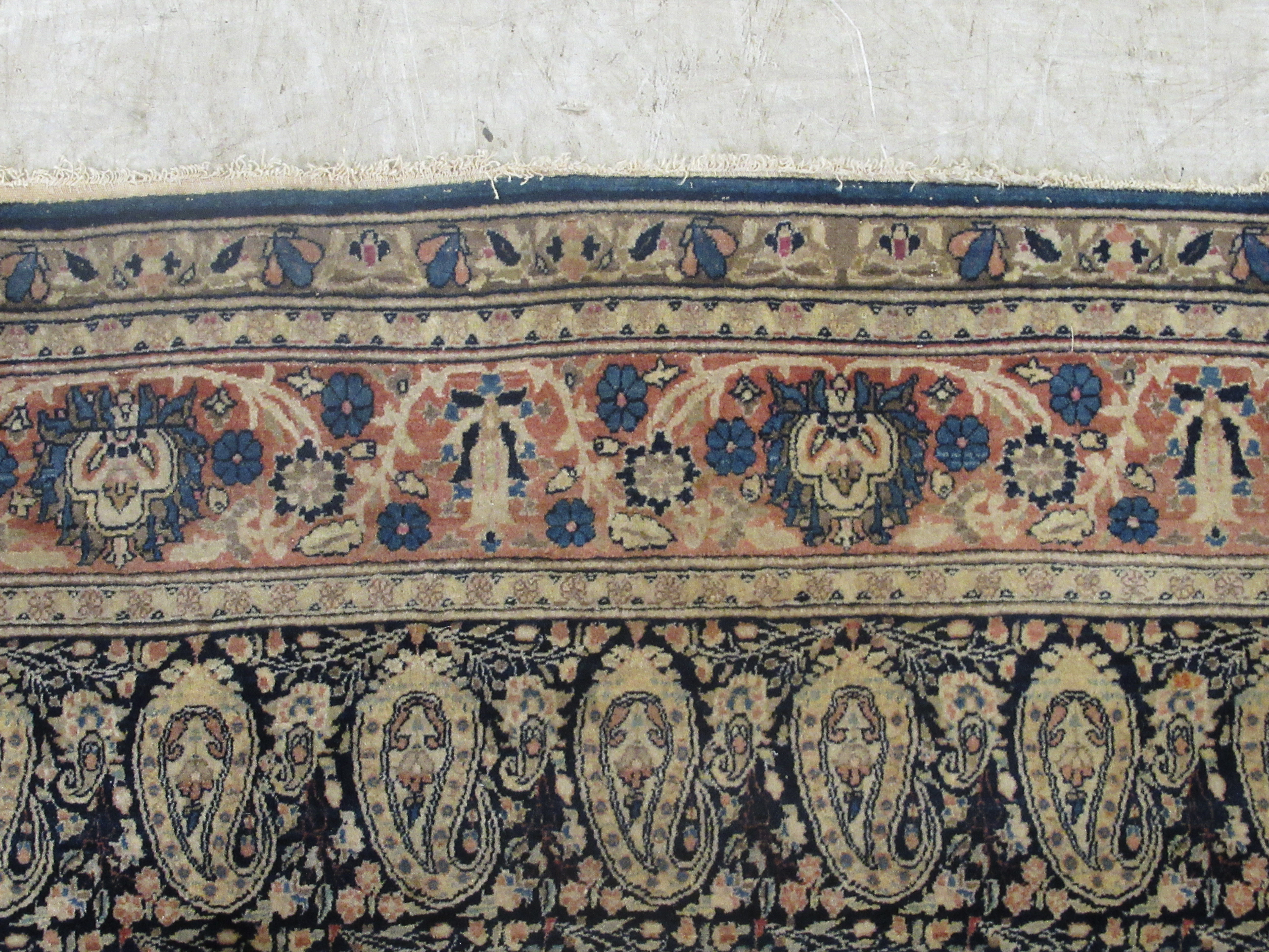 A Persian rug, decorated with repeating stylised designs, bordered by flora and foliage, on a - Image 3 of 5