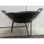 An (as new) cast iron combination fire pit/bbq  16'h  23''dia