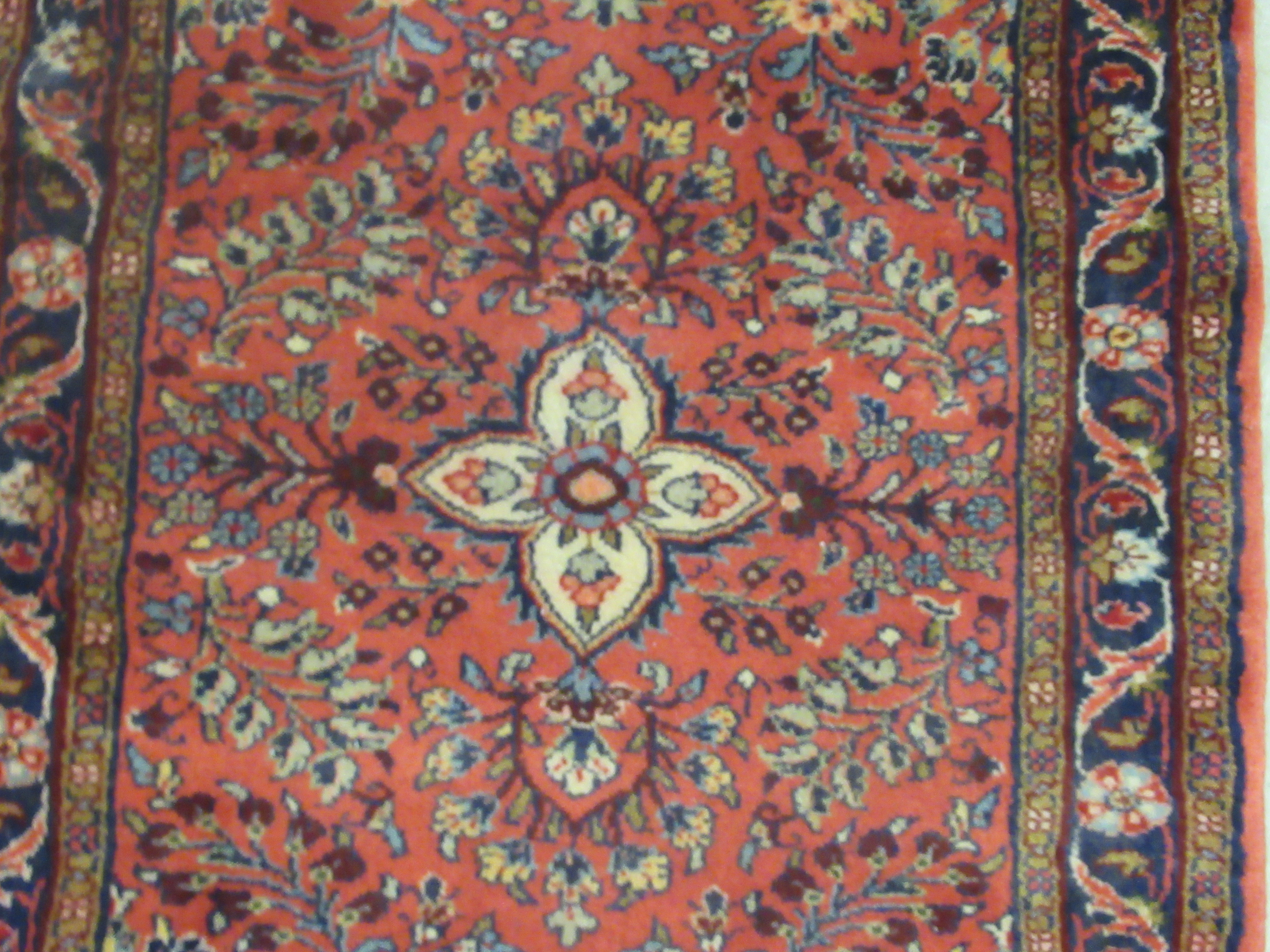 A Persian runner, decorated with floral motifs, on a red ground  106'' x 33'' - Image 2 of 5