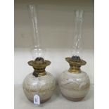 A pair of Wynchcome pottery, Joe Finch oil lamps with glass funnels  17"h