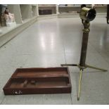 A 19thC lacquered brass folding tabletop telescope stand, on a tripod base  approx.12.5''L