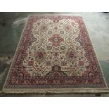 A Caucasian rug, decorated with floral and foliate designs, on a cream coloured ground  78'' x 110''