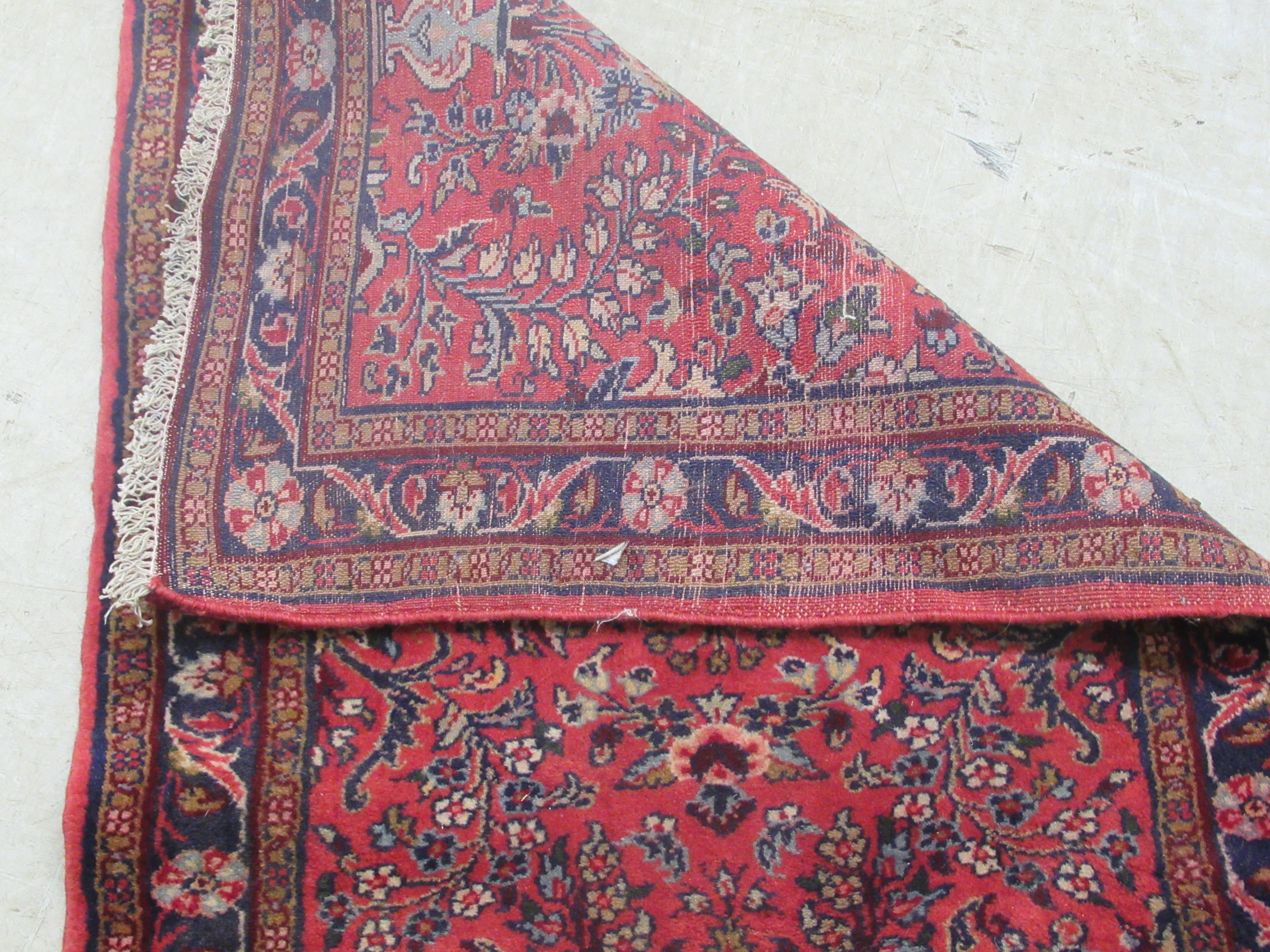 A Persian runner, decorated with floral motifs, on a red ground  106'' x 33'' - Image 5 of 5