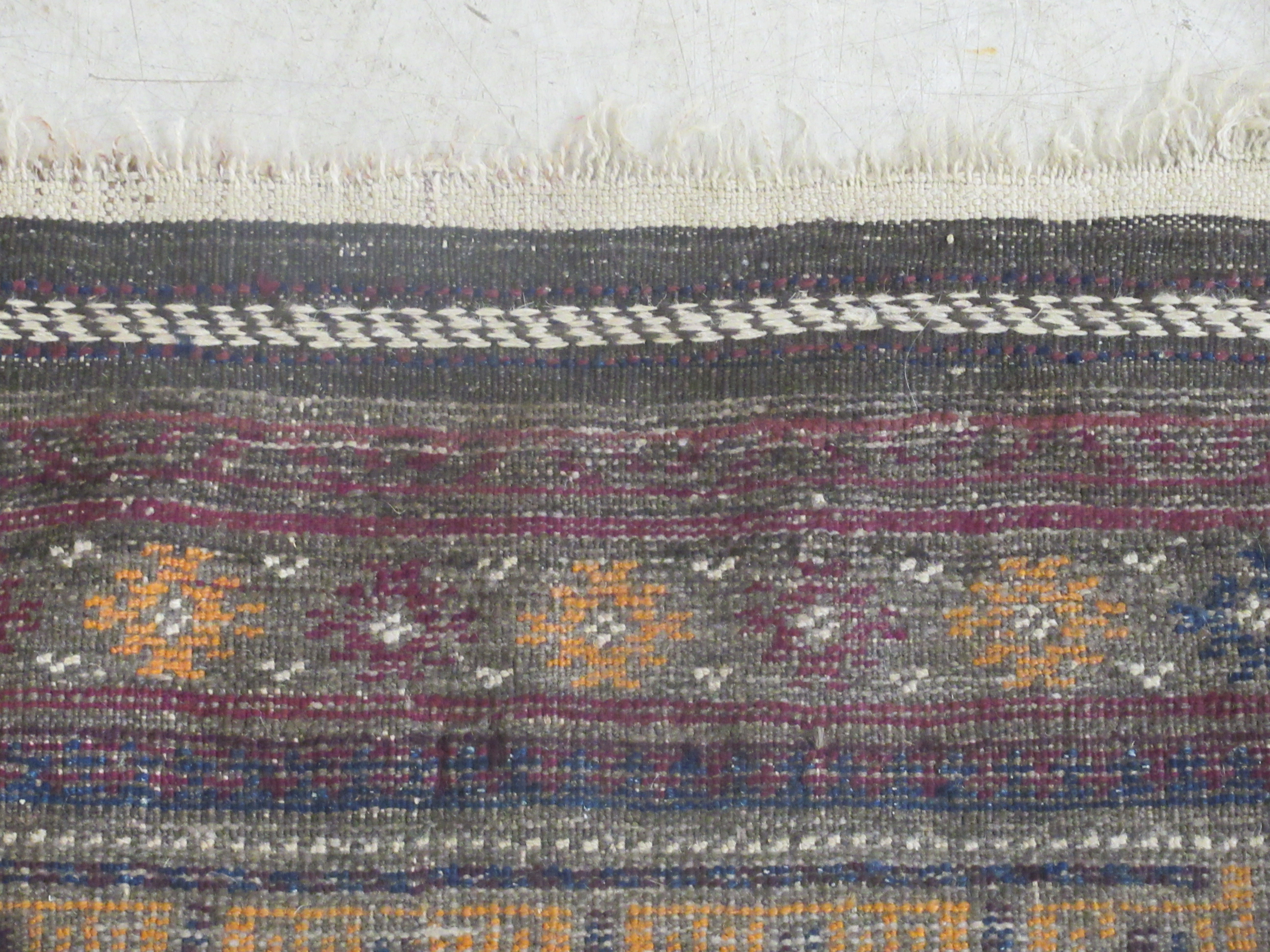 A Baluchistan rug, decorated with repeating stylised designs, on a brown ground  35'' x 42'' - Image 5 of 6