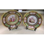Two early/mid 20thC Vienna porcelain plates with overpainted floral cartouches and gilding  bears