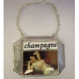 A silver plated and enamelled Champagne label, on a chain