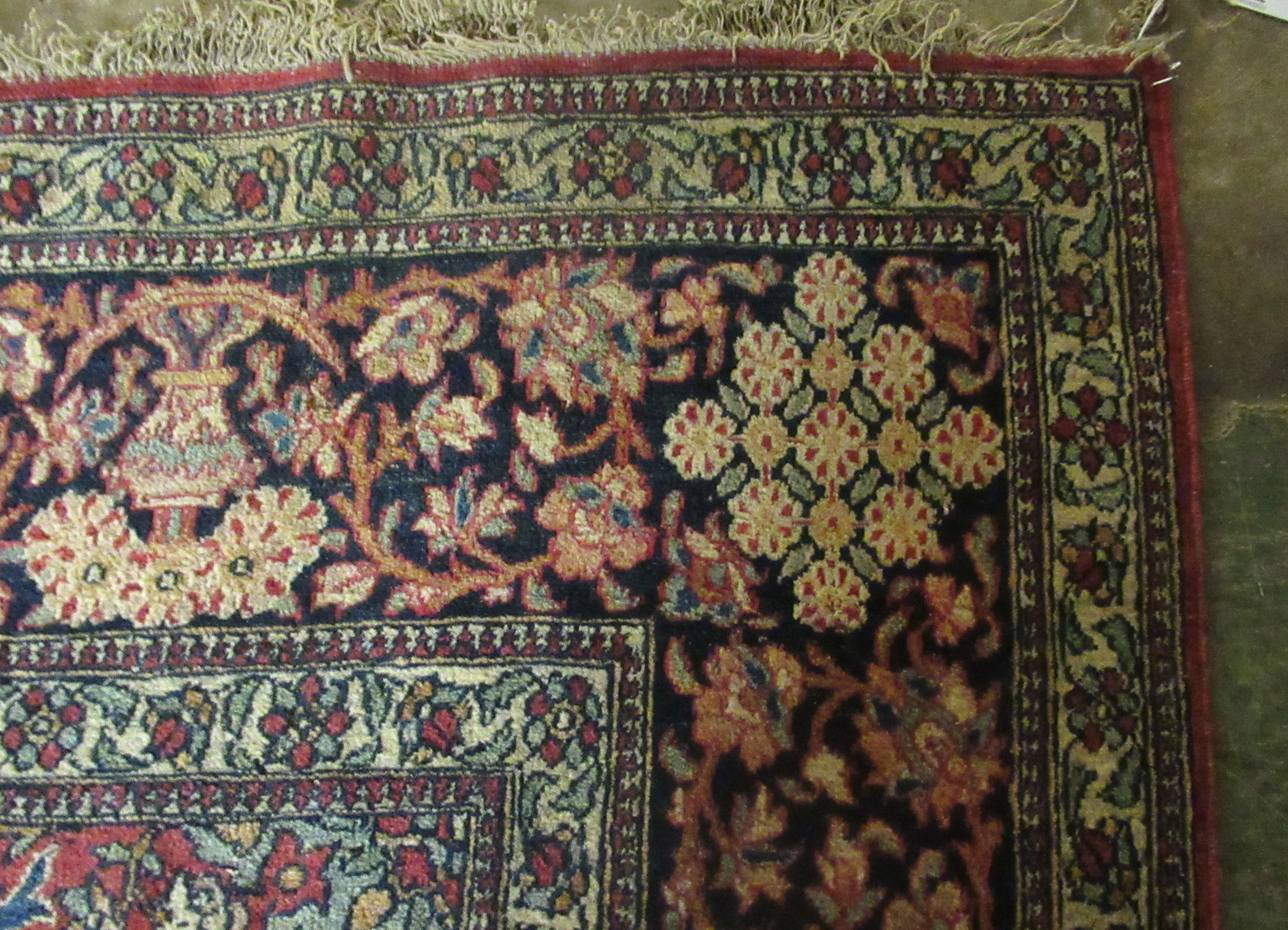 A Persian rug, decorated with a serpentine outlined medallion, bordered by stylised designs on a - Image 4 of 5