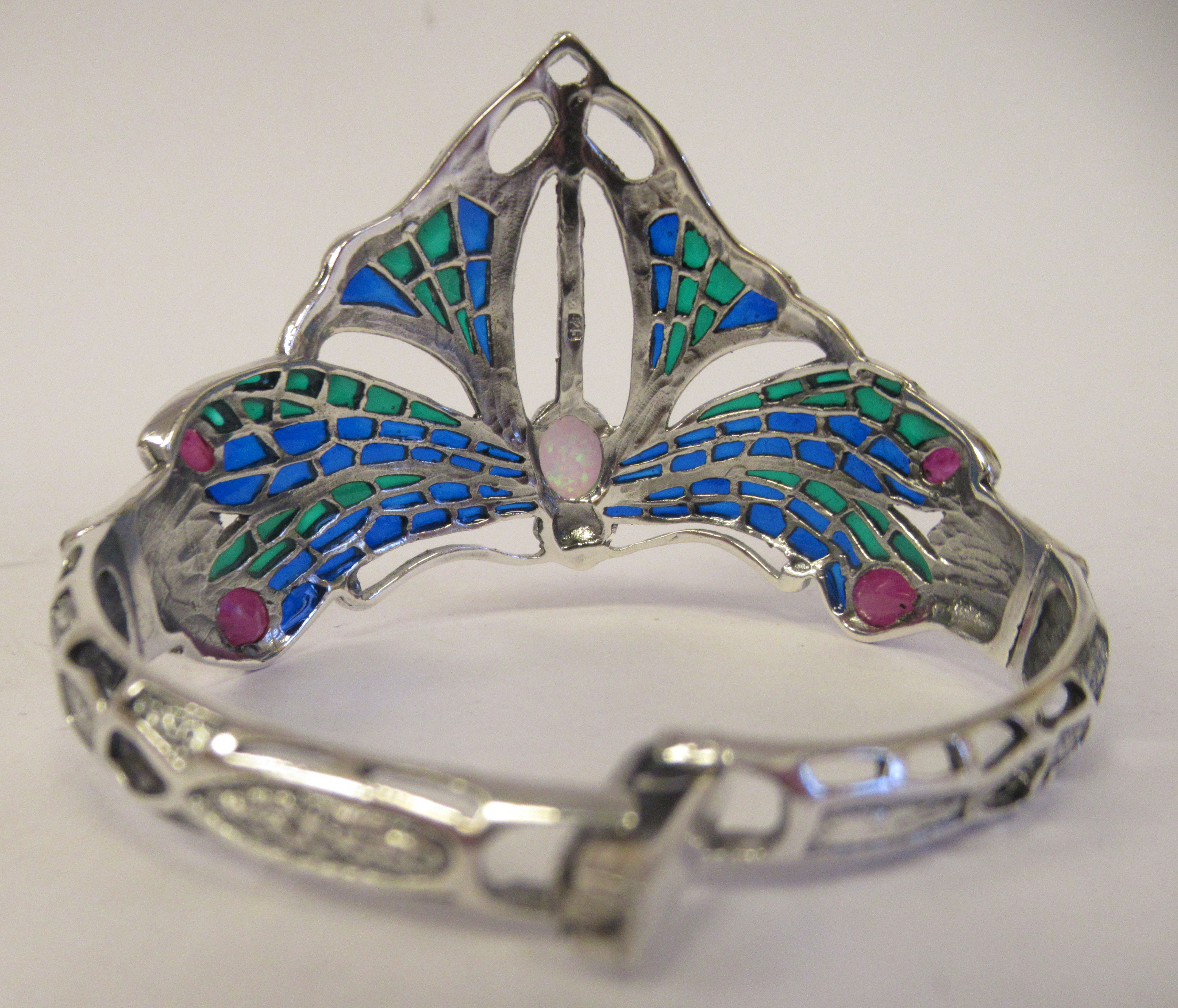 A silver pliqué-a-jour butterfly design, hinged bangle, set with an opal and rubies - Image 2 of 5