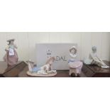 Nao and Nadal porcelain figures: to include a seated girl, holding a puppy  6''h