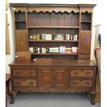 A reproduction of a George III crossbanded mahogany and oak dresser, the superstructure with a