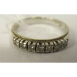 An 18ct white gold seven stone diamond ring