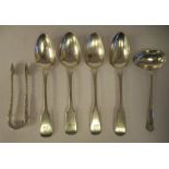 A matched set of four early 19thC silver fiddle pattern teaspoons; a feeder spoon; an a pair of