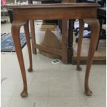 A 1920s mahogany side table, the box top raised on slender legs and pad feet  29''h  33''w