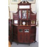 An Edwardian mahogany side cabinet, the superstructure comprising an arrangement of bevelled mirrors