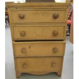 An early 20thC waxed pine dressing chest with four graduated long drawers, raised on bracket feet