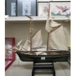 A scratch built wooden model two masted ship  26"L