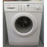 A Bosch Classixx 6 1200 Express washing machine  33''h  23.5''w