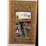 An early 20thC bevelled mirror, set in a wide, tapestry fabric covered frame  34'' x 21''