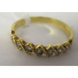 An 18ct gold seven stone set diamond ring