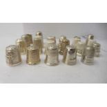 Twenty-two assorted and variously decorated silver, silver coloured and white metal thimbles