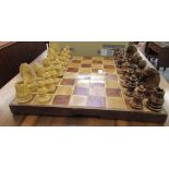 A modern ceramic, two tone tiled chessboard  20''sq with hollow pottery pieces  the kings 3.25''h
