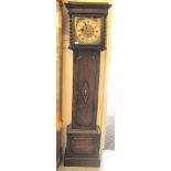 A 1920s/30s oak cased grandmother clock; the weight driven Westminster chime movement faced by a