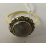 An 18ct opal and diamond cluster ring
