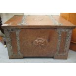 An early 20thC Arts & Crafts copper clad coal bin incorporating an angled, hinged lid, wrought metal
