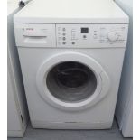 A Bosch Classixx 6 1200 Express washing machine  33''h  23.5''w